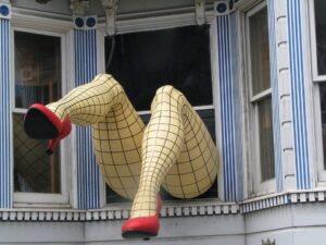 The famous fishnet-clad legs hanging out of a Victorian window above Piedmont Boutique in Haight-Ashbury, San Francisco.